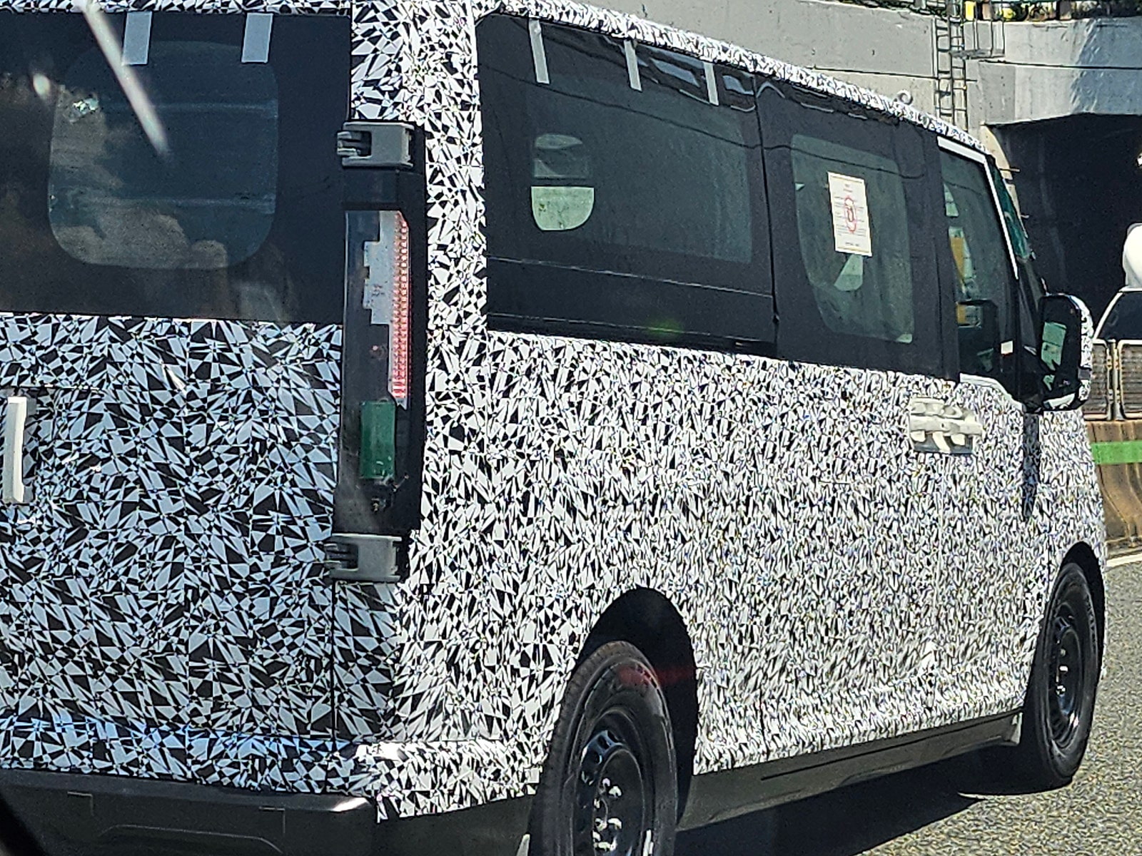Kia’s larger electric van caught with less camo ahead of its ‘big’ debut [Images]